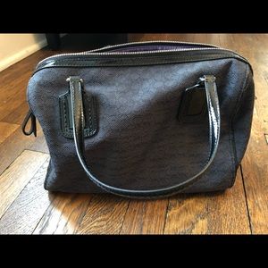 Med sized black coach satchel w/ small “c” pattern